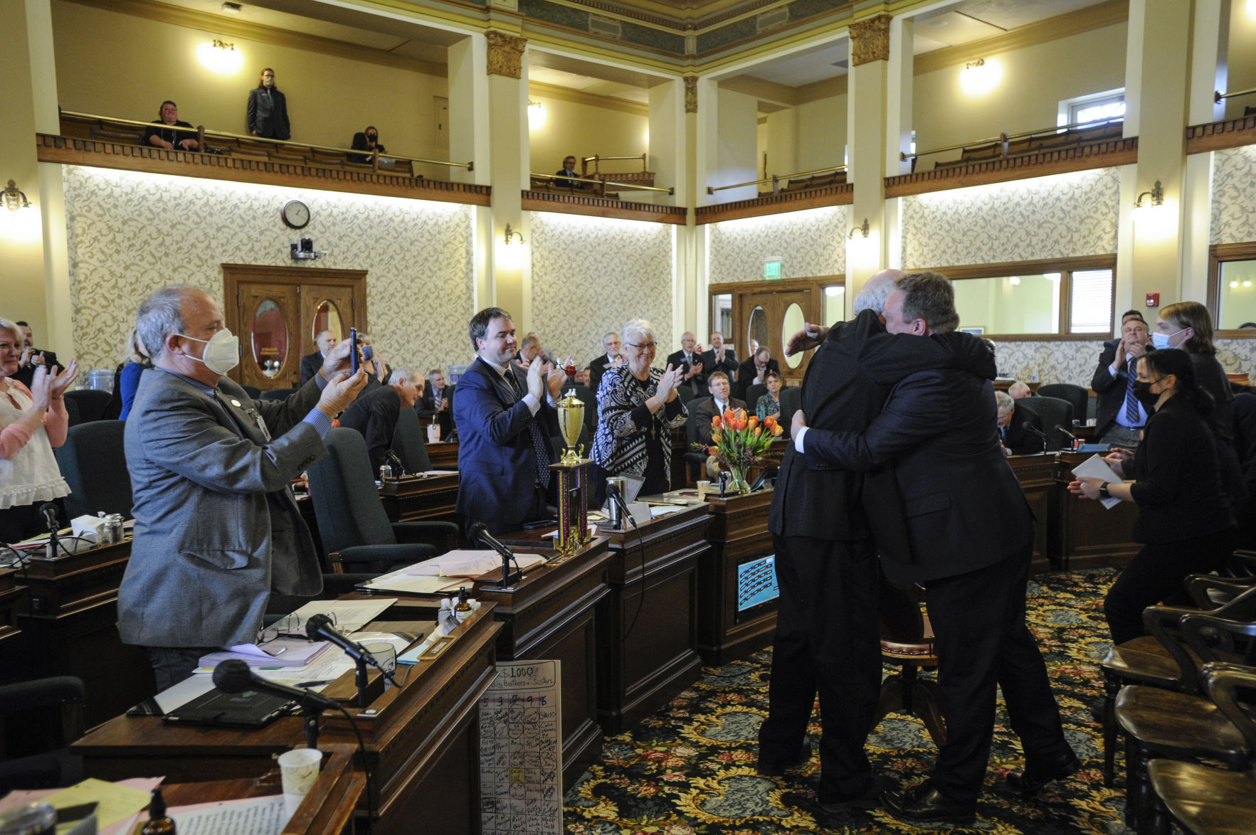 Sen. Gordon Vance, R-Belgrade, hugs Senate President Mark Blasdel, R-Kalispell,